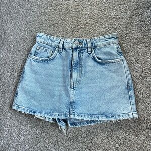 Super cute light wash jean skort from Zara. No flaws. Worn once